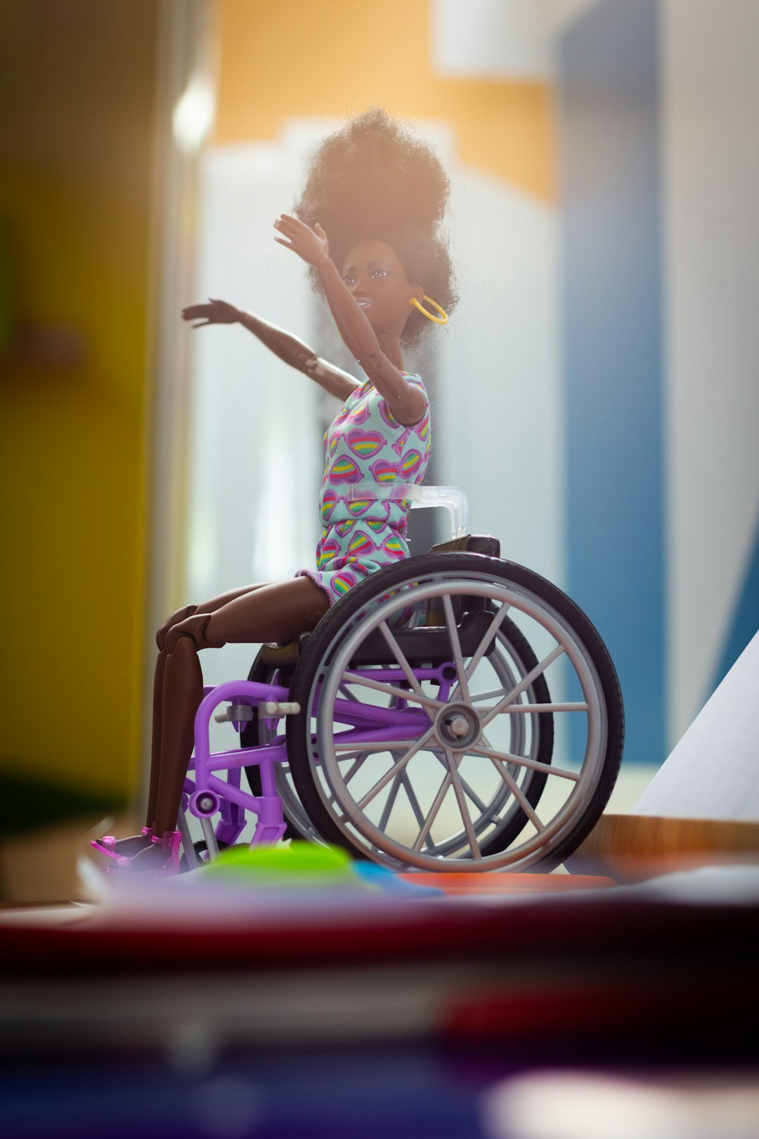a-doll-is-sitting-in-a-wheel-chair-e-n65bbqtmi