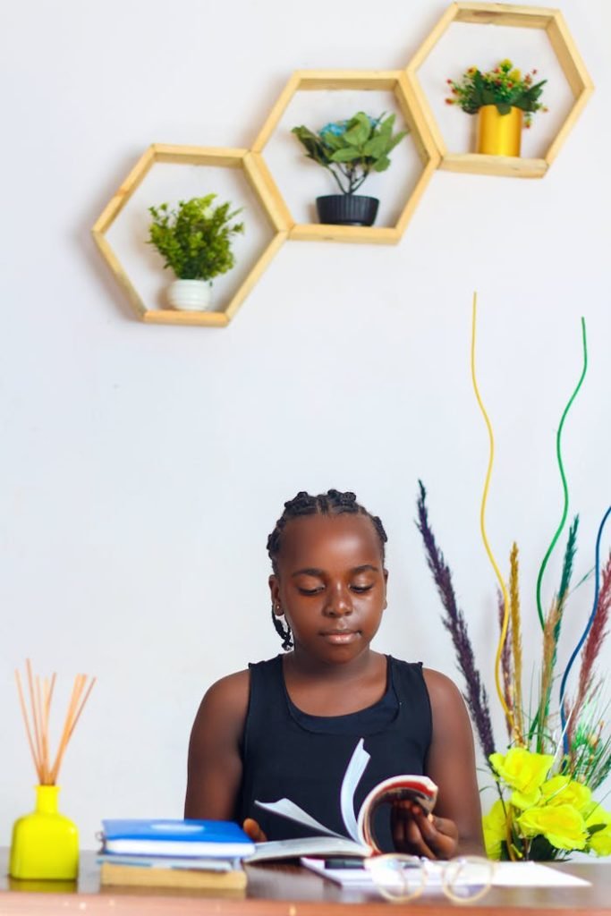 The Art of Drawing Readers In: Your attractive post title goes here Teenage girl with braided hair reading in a stylized room with decorative elements.