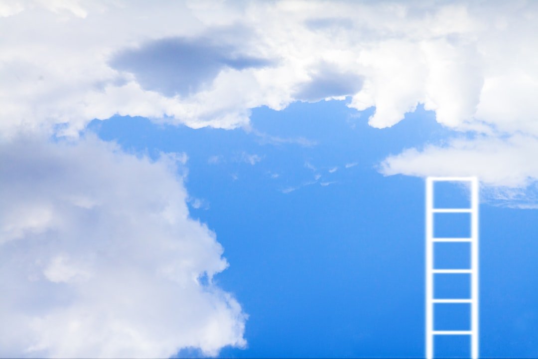 Ladder Reaching Into A Bright Blue Sky With Clouds Utqzpycoops