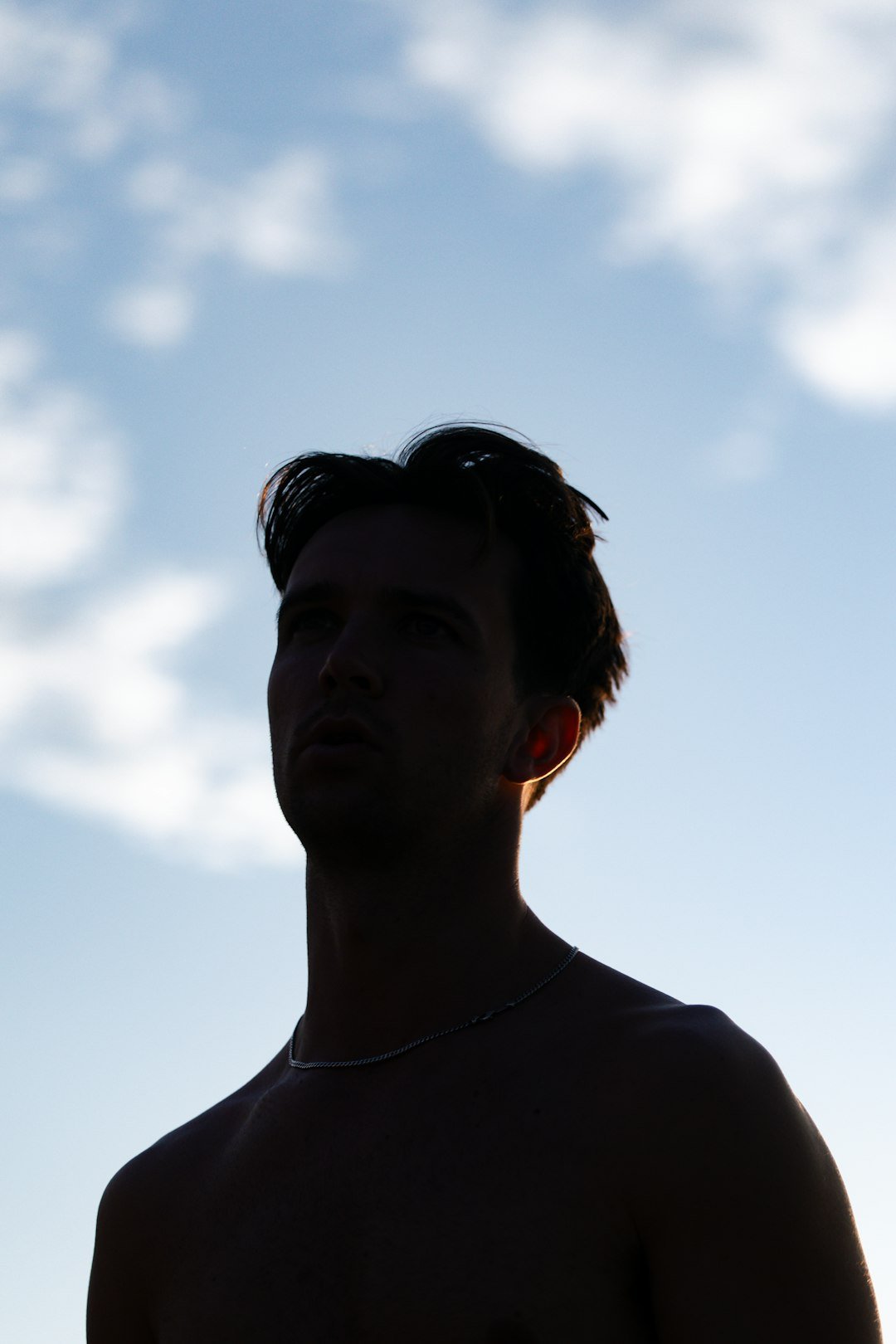 silhouette-of-a-man-against-a-cloudy-sky-nrsweax3epi