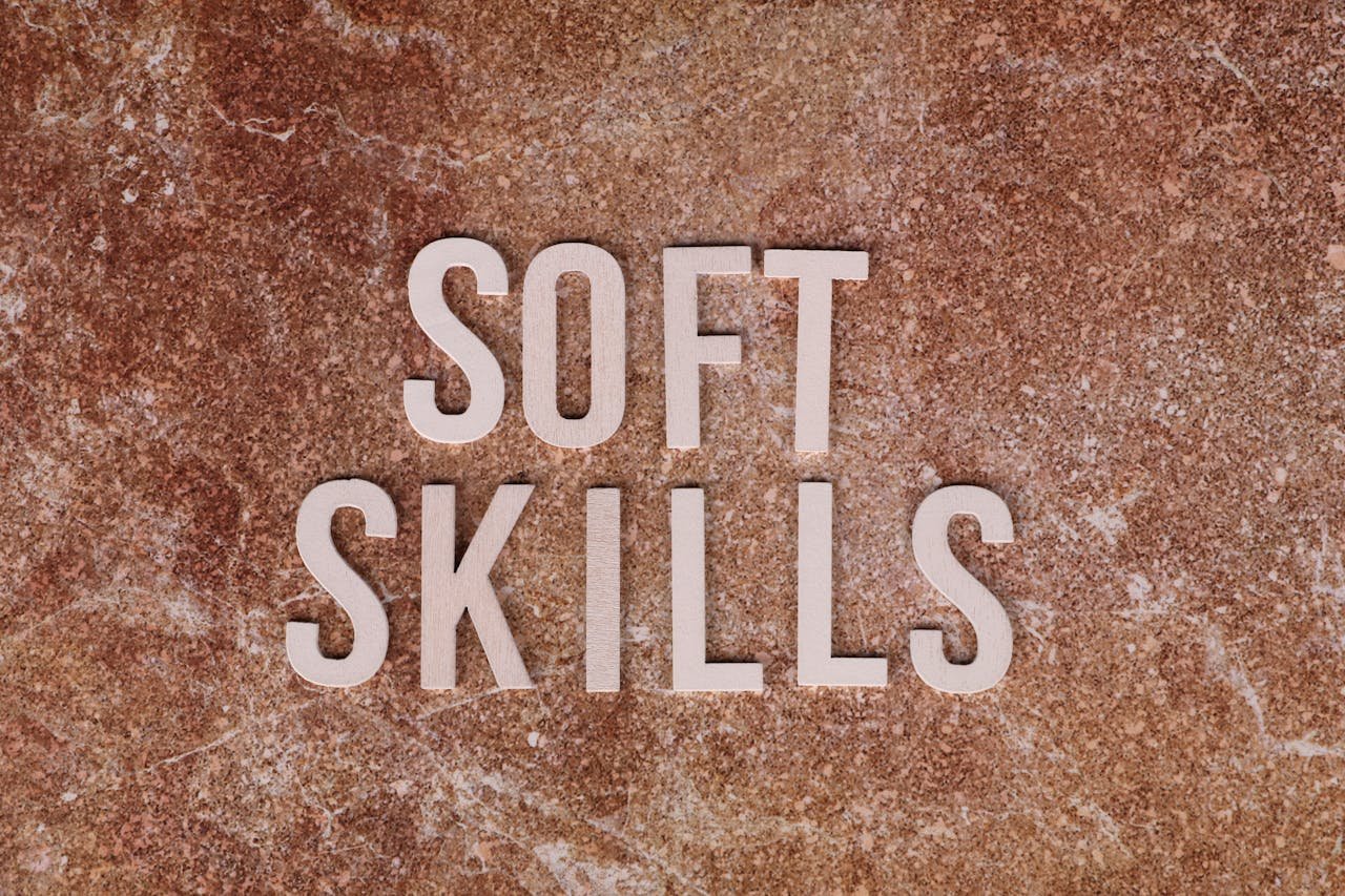 Close-up of the words Soft Skills on a textured stone background for presentations or articles.